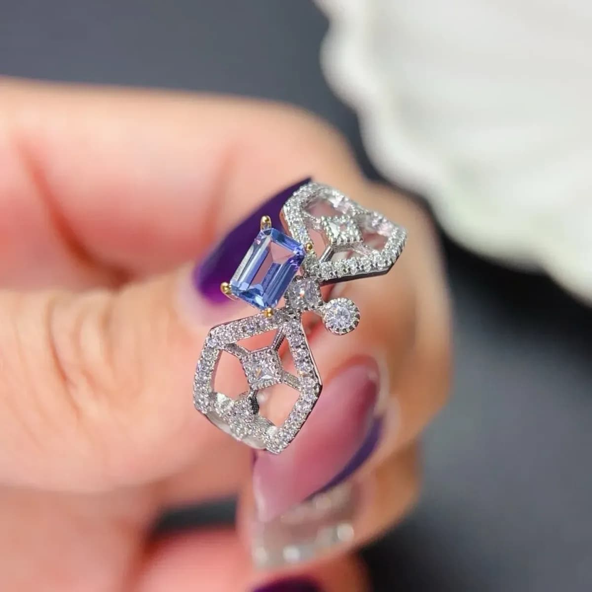 angled view of the tanzanite ring showing the emerald cut stone
