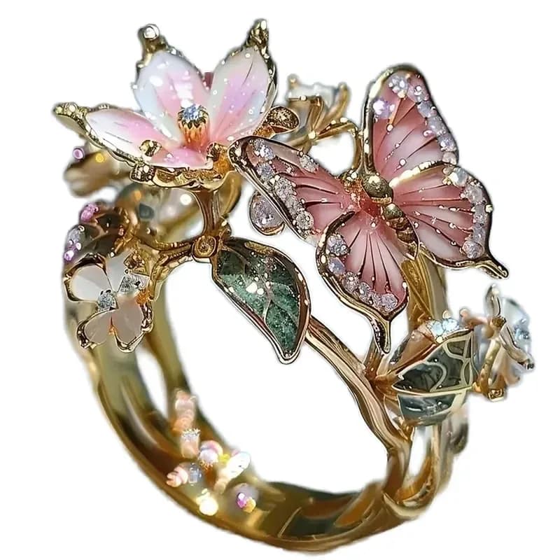 gold-tone butterfly scarf ring with pink blossom and green leaves