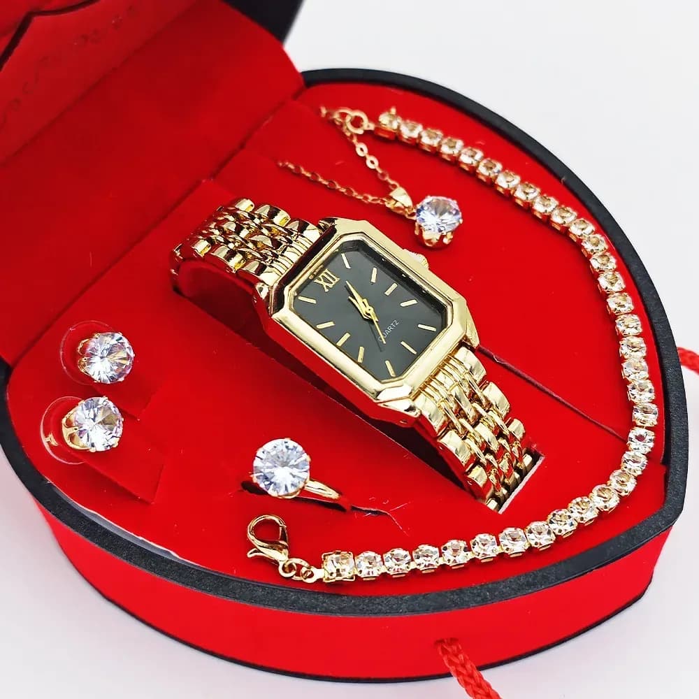 rectangular watch and jewelry gift set in a red heart box, gold tone with black dial