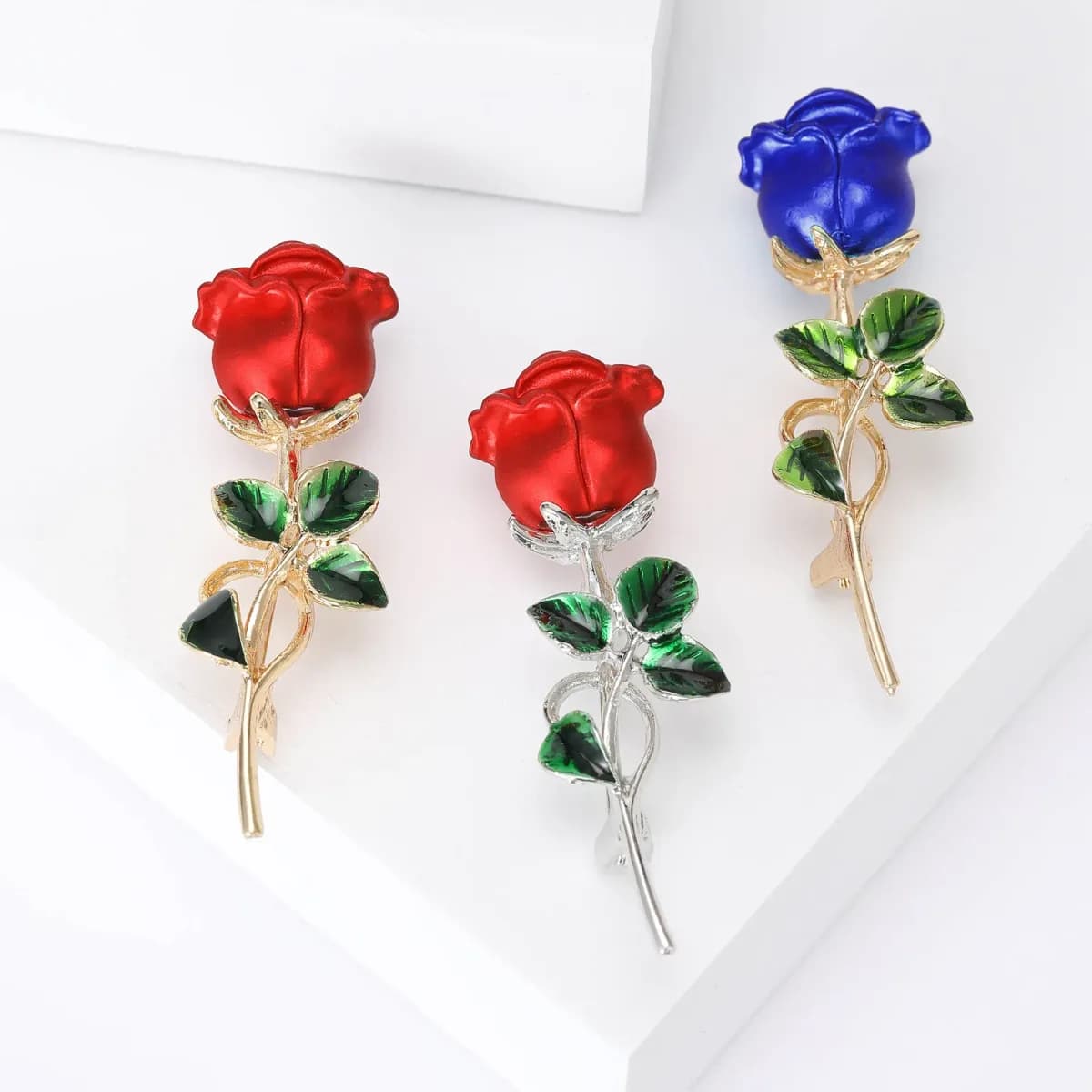 long stem rose brooch pins in red and blue