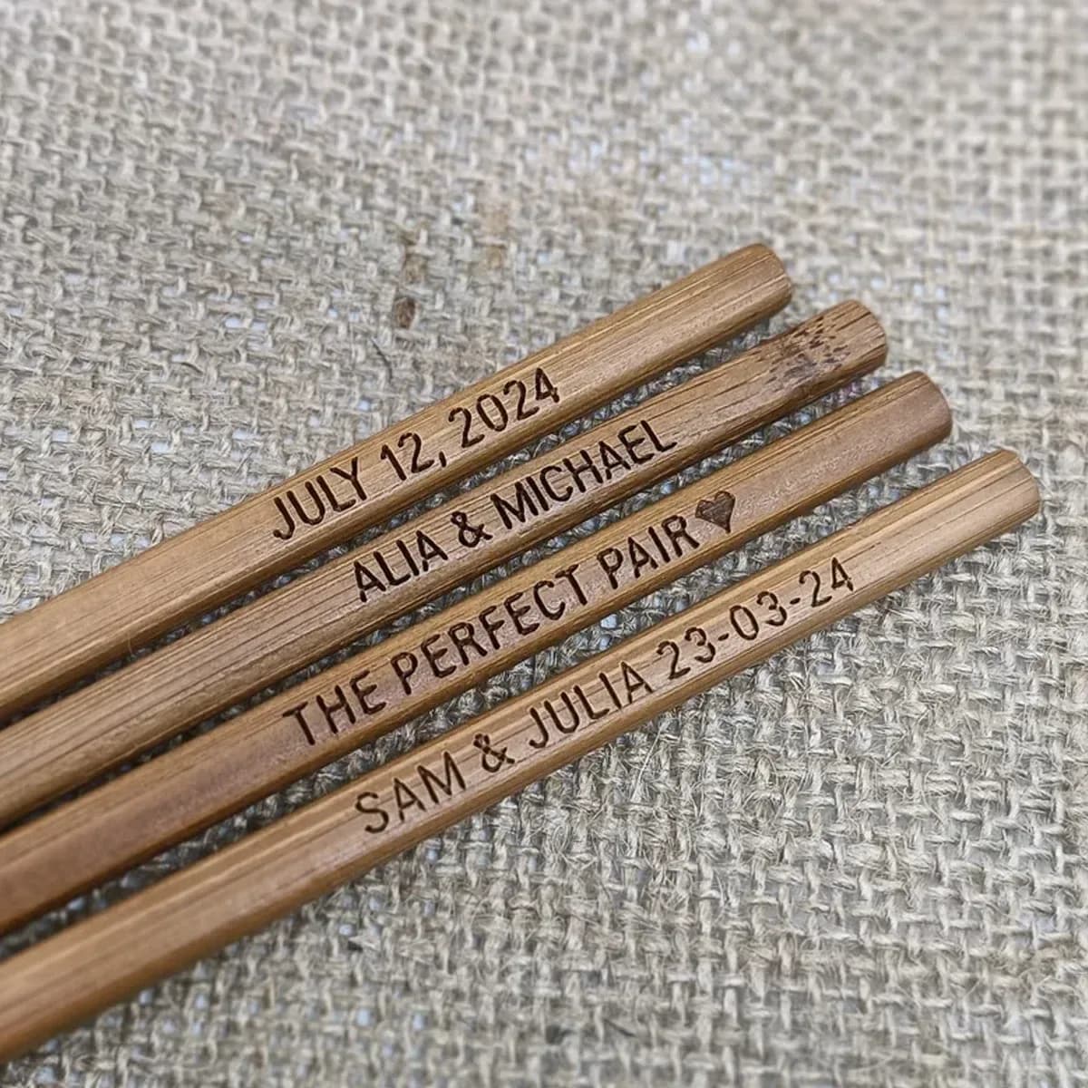 personalized engraved bamboo chopsticks in dark bamboo with names and dates